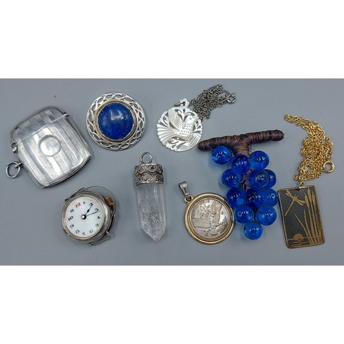 112 - A Birmingham silver vesta case by William Hair Haseler, with engine turned decoration together with ... 