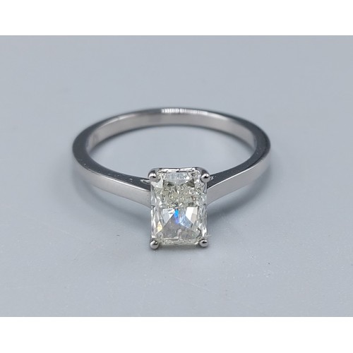 118 - A Platinum solitaire Dimond ring set with baguette cut Diamond, approx 1ct, ring size L, 3.2gms