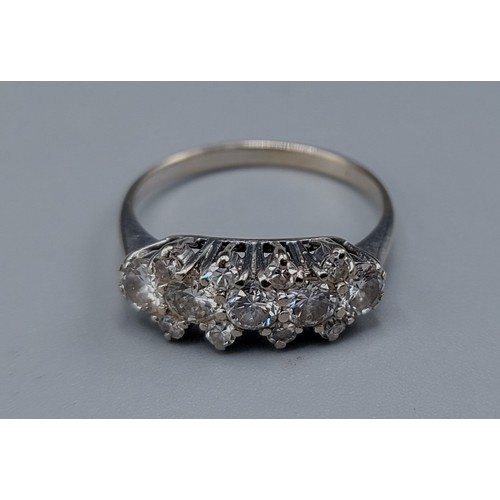 123 - A white gold Diamond cluster ring, set with thirteen Diamonds within a pierced setting, ring size N,... 