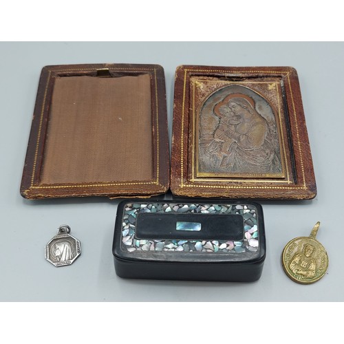 195 - A engraved copper panel depicting Madonna and Child signed B. Wicker, 7cms by 4.5cms within leather ... 