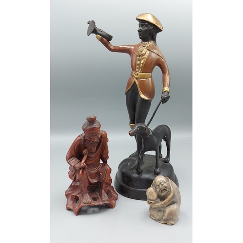 197 - A Patinated metal figure with dog together with a soapstone carving and a root carving in the form o... 