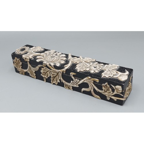 198 - A Chinese carved hard stone box, the hinged cover decorated in relief with a foliate design, 20cms l... 