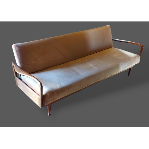 251 - Greaves and Thomas, a sofa bed settee with shaped arms raised upon low turned legs, 204cms long