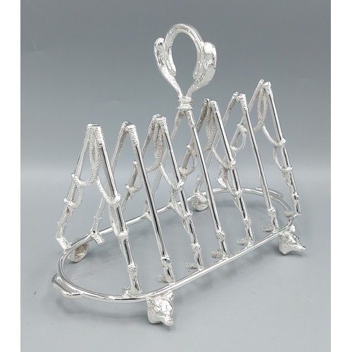 A six division toast rack in the form of riding crops with foxes head ...