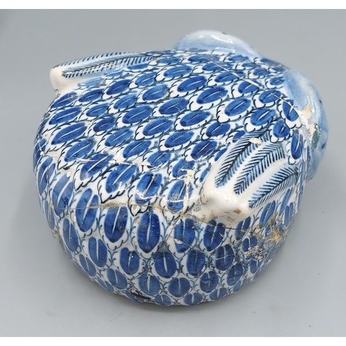 33 - A Delft blue and white armorial tobacco jar in the form of an owl with Boch mark to base and numbere... 