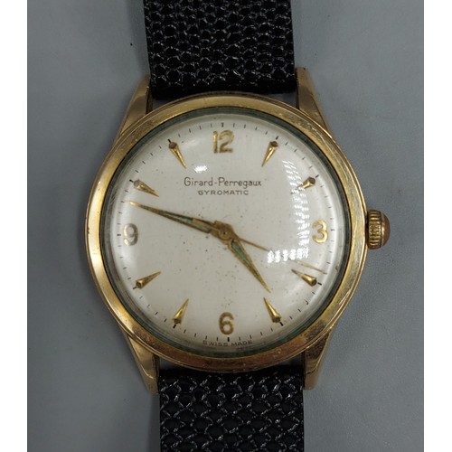 77 - A gold plated gentlemans wristwatch by Girard Perregaux Gyromatic with leather strap