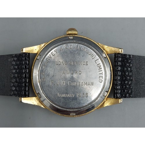 77 - A gold plated gentlemans wristwatch by Girard Perregaux Gyromatic with leather strap