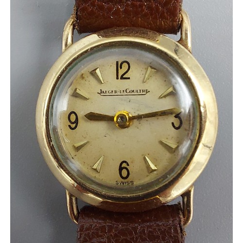 80 - A 9ct gold cased ladies wristwatch by Jaegar LeCoultre with leather strap