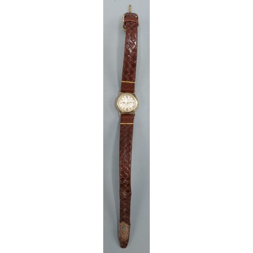 80 - A 9ct gold cased ladies wristwatch by Jaegar LeCoultre with leather strap