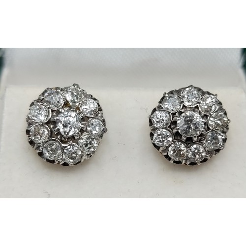85 - A pair of gold Diamond cluster ear studs, each set with a central Diamond surrounded by Diamonds, cl... 