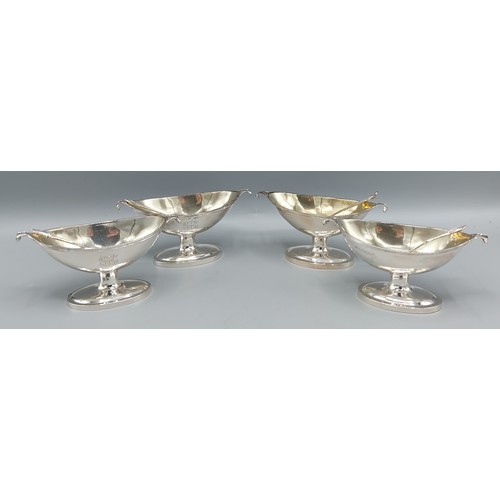 90 - A set of four Victorian silver salts within fitted lined case with matching spoons, London 1884, mak... 