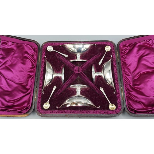 90 - A set of four Victorian silver salts within fitted lined case with matching spoons, London 1884, mak... 