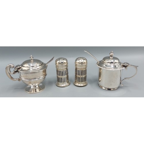 92 - A Birmingham silver mustard together with another similar Birmingham silver mustard, a pair of Birmi... 