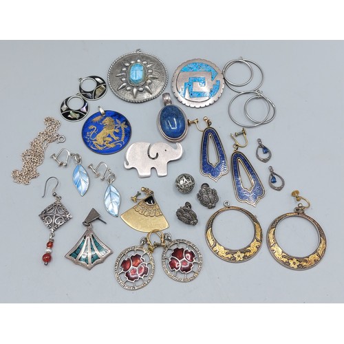 101 - A collection of pendants and brooches, some silver
