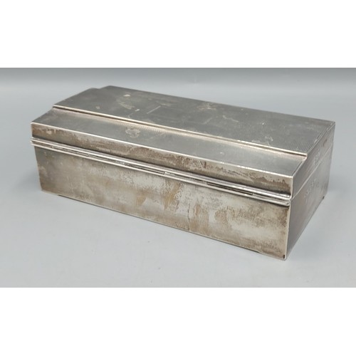 106 - A Birmingham silver cigarette box with engine turned decoration, 18cms long