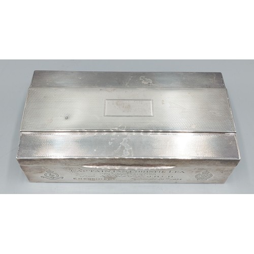 106 - A Birmingham silver cigarette box with engine turned decoration, 18cms long