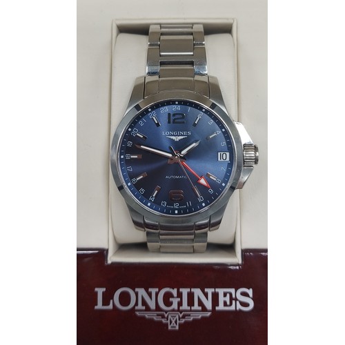 112 - A Longines Conquest stainless steel cased gentlemans wristwatch with blue dial and within original b... 