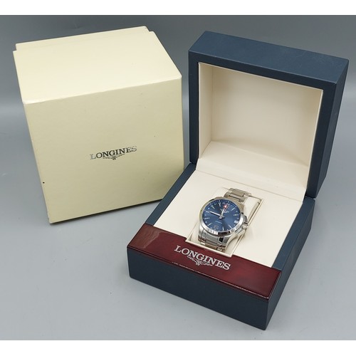 112 - A Longines Conquest stainless steel cased gentlemans wristwatch with blue dial and within original b... 