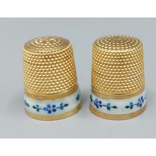 113 - A Pair of silver gilt and enamel decorated thimbles