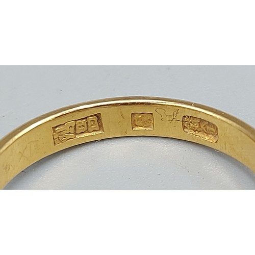 115 - A Chinese gold ring set oval Garnet, 4.4gms, ring size M