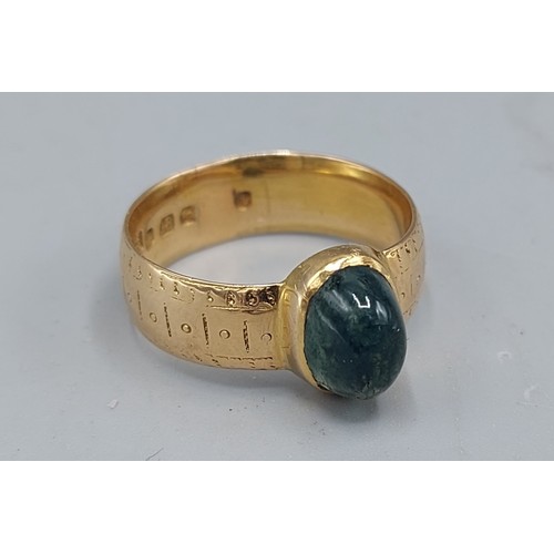 116 - An 18ct gold ring set with a green Cabochon stone, 6.9gms, ring size Q