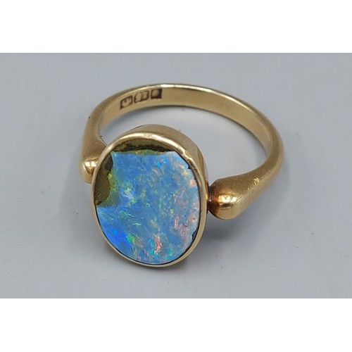 117 - A 15ct gold ring set with an oval Opal, 5.3gms, ring size O