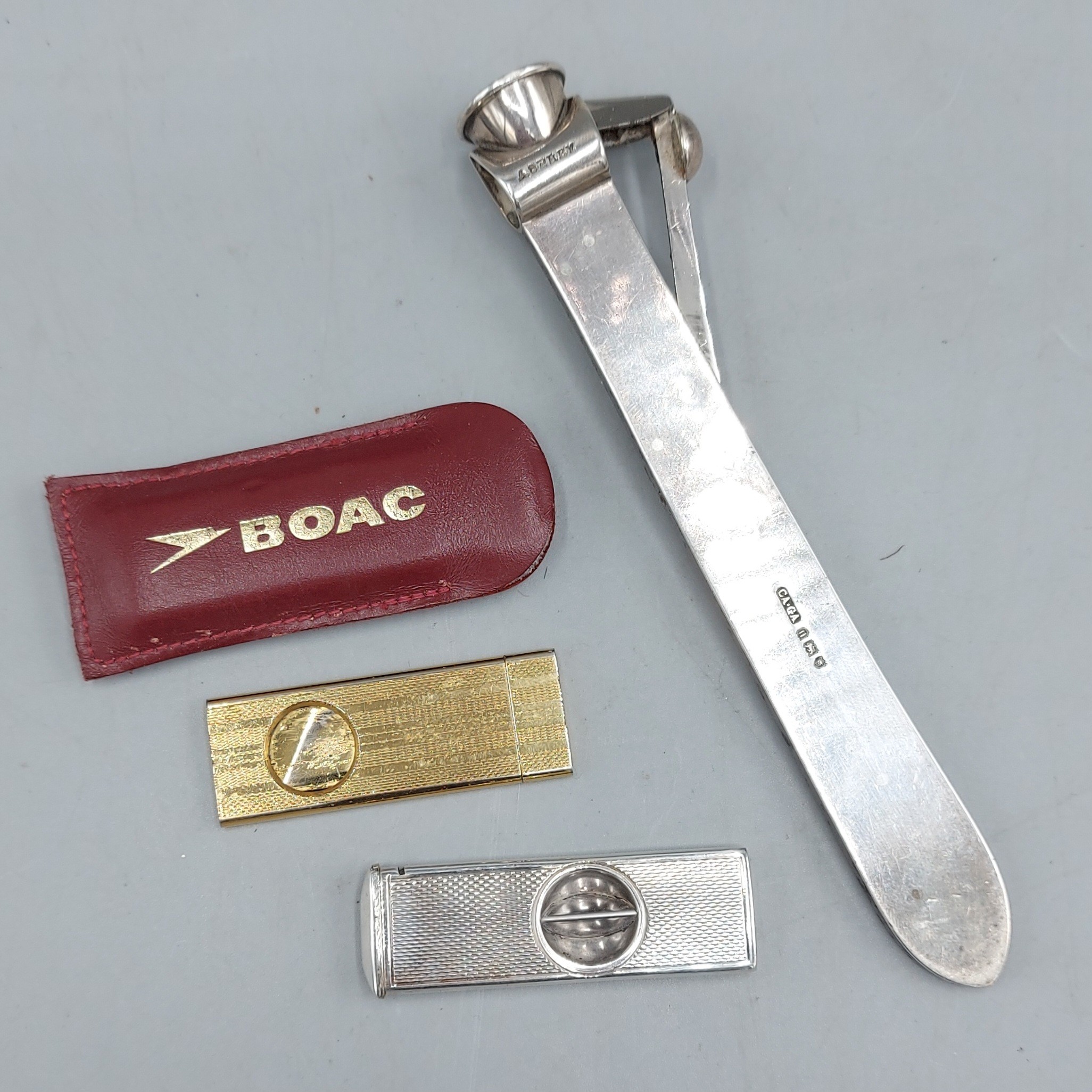A London silver cigar cutter by Asprey together with a Birmingham ...
