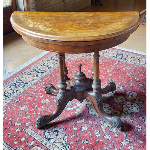 344 - A Victorian walnut and marquetry inlaid Demi-lune card table, the hinged top enclosing a beize lined... 