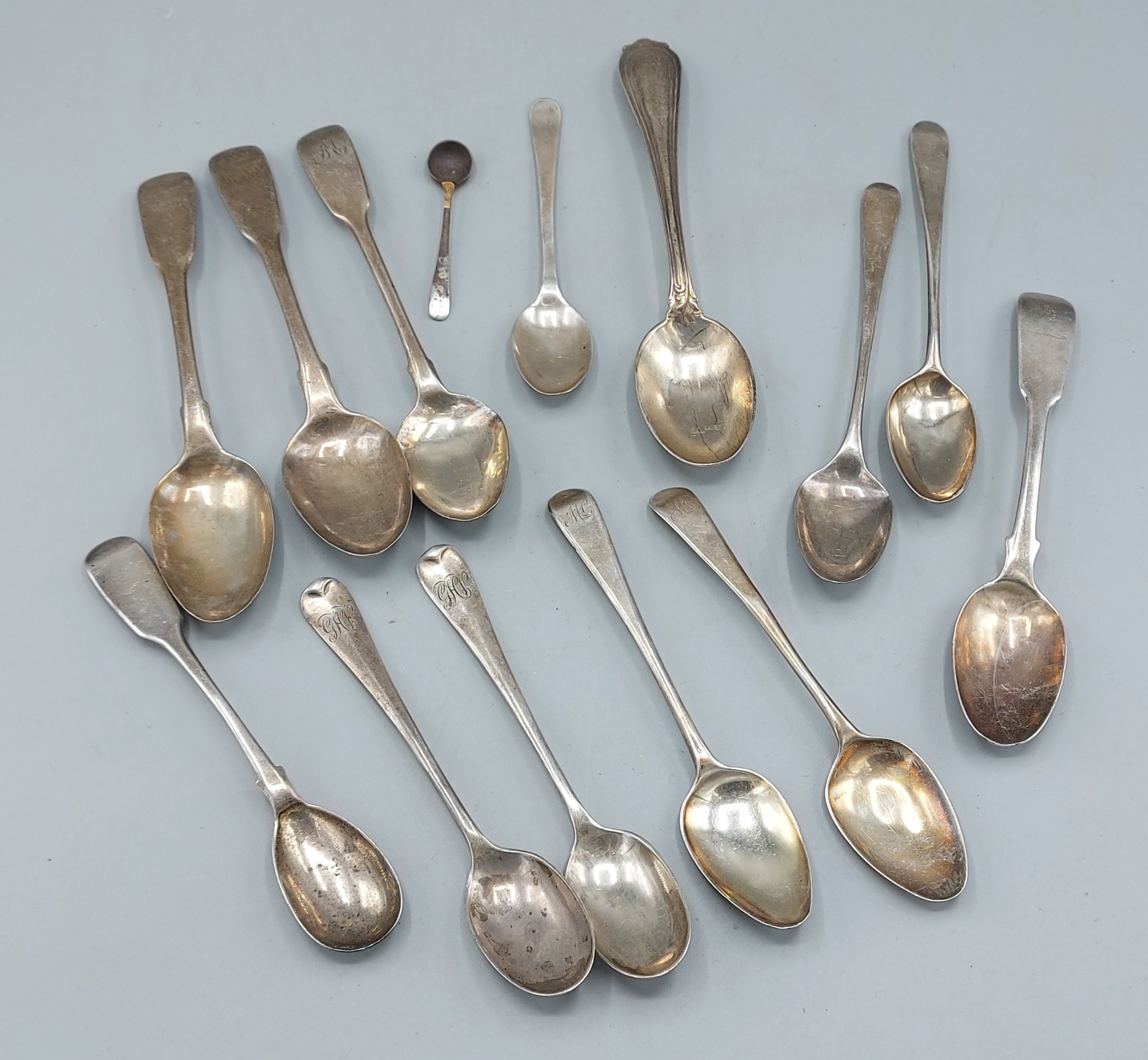 A collection of silver teaspoons and a silver mustard spoon, 8ozs