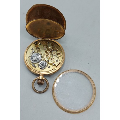 141 - A 14ct gold cased fob watch, the enamel dial with Roman numerals and with engraved case, 28.6gms inc... 