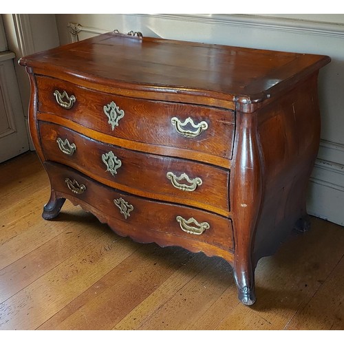 373 - An 18th Century French oak serpentine Bombe commode, the moulded top above three drawers with brass ... 