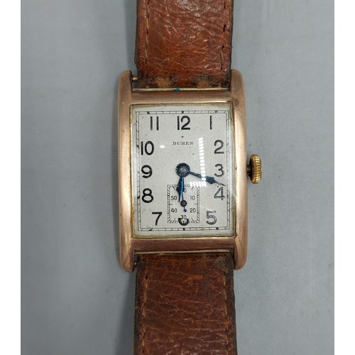 145 - A 9ct gold cased wristwatch by Buren with leather strap, 6.7gms excluding movement