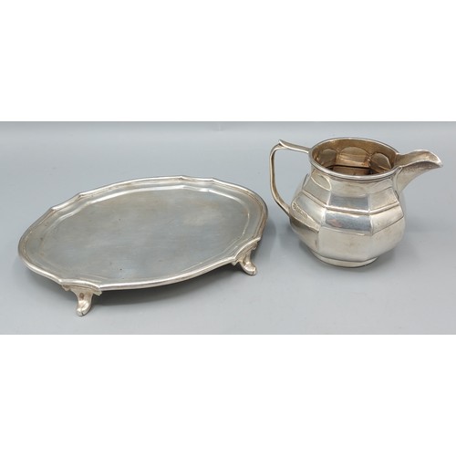 166 - A London silver Waiter of oval form inscribed Edmonds and Co. Baker Street together with a Birmingha... 