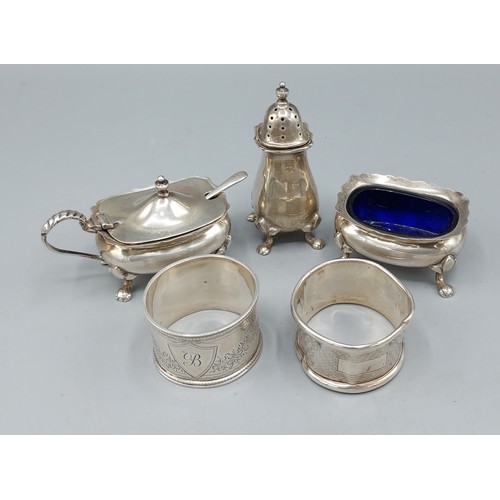 168 - A Birmingham silver three piece condiment set together with two silver napkin rings, 4.5ozs