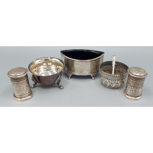 185 - A Birmingham silver salt with blue glass liner together with a pair of Birmingham silver peppers and... 