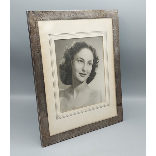 189 - A London silver rectangular photgraph frame, 33.5cms x 33.5cms x 27cms