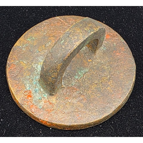 187 - A Medieval Bronze Seal Matrix with crowned figure amongst Cypher with loop, 5.5cms diameter