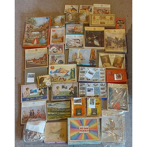 272 - A collection of Jigsaw puzzles by Chad Valley to include A Cotswold Alley, Cunard and others