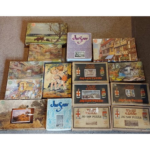 302 - A collection of Jisaw puzzles by Chad Valley to include Noonday Rest, GWR Freight Train and others