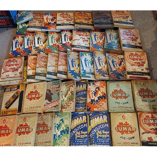 381 - A large collection of Jigsaw puzzles by Lumar