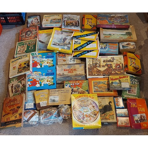 383 - A collection of Jigsaw puzzles by Waddingtons together with a collection of other puzzles