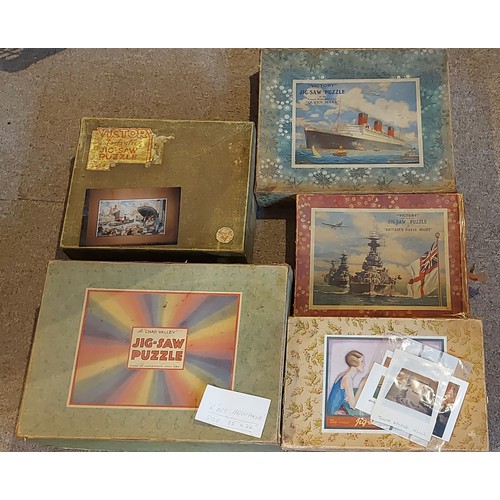 389 - A Jigsaw puzzle by Chad Valley R.M.S. Aquitania together with another by Chad Valley and three puzzl... 