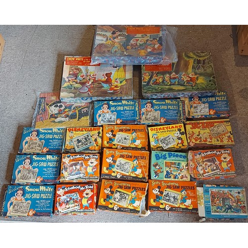 396 - Two Walt Disney Jigsaw puzzles by Williams Ellis and Co. together with a collection of Walt Disney p... 
