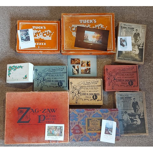409 - A Raphael Tuck and Sons Zag Zaw Jigsaw puzzle Summer Party together with a collection of other puzzl... 