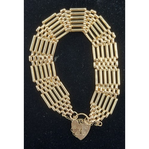 143 - A 9ct gold bar gate linked bracelet with padlock clasp, 11.5g