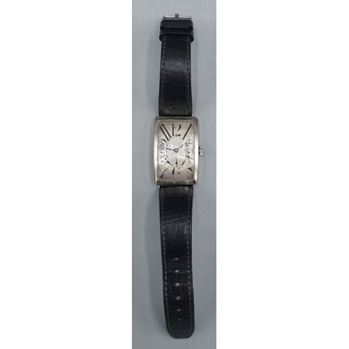 147 - A white metal case Gentleman's wristwatch by Dandy, the rectangular dial with roman numerals and sec... 