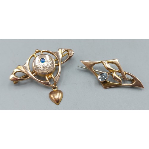 152 - A 9ct gold brooch of pierced form together with an unmarked brooch, 3.6gms