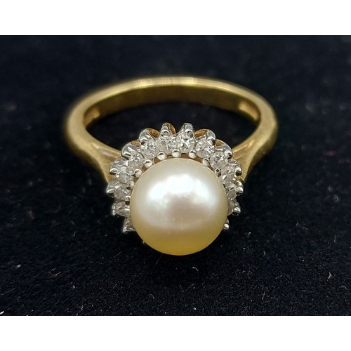 157 - An 18ct gold ring set with a large central Pearl surrounded by Diamonds, 5.2gms, ring size M
