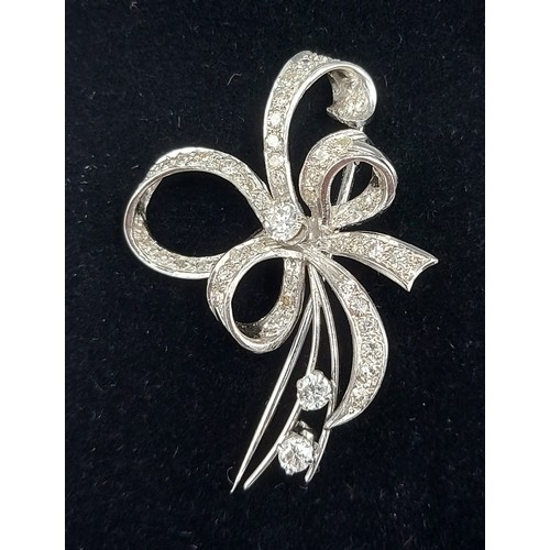 163 - An 18ct white gold Diamond set brooch of bow form7.8gms, 4.5cms long