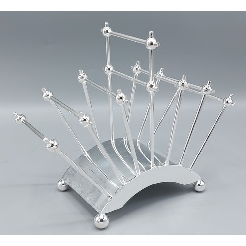 174 - An Art Deco style six division toast rack of curved form, 18cms tall